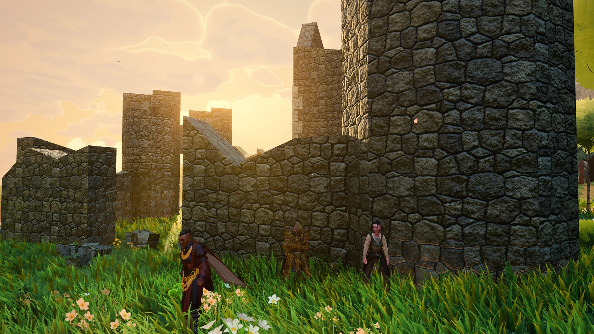 Players stand beside a stone fortification in evening light.